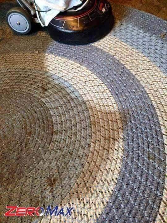 Professional carpet cleaning equipment removing dirt from patterned residential carpeting